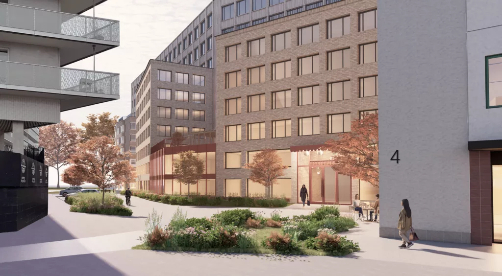 1. En modern byggnad med stora fönster och omgivande grönska, människor promenerar längs trottoaren.