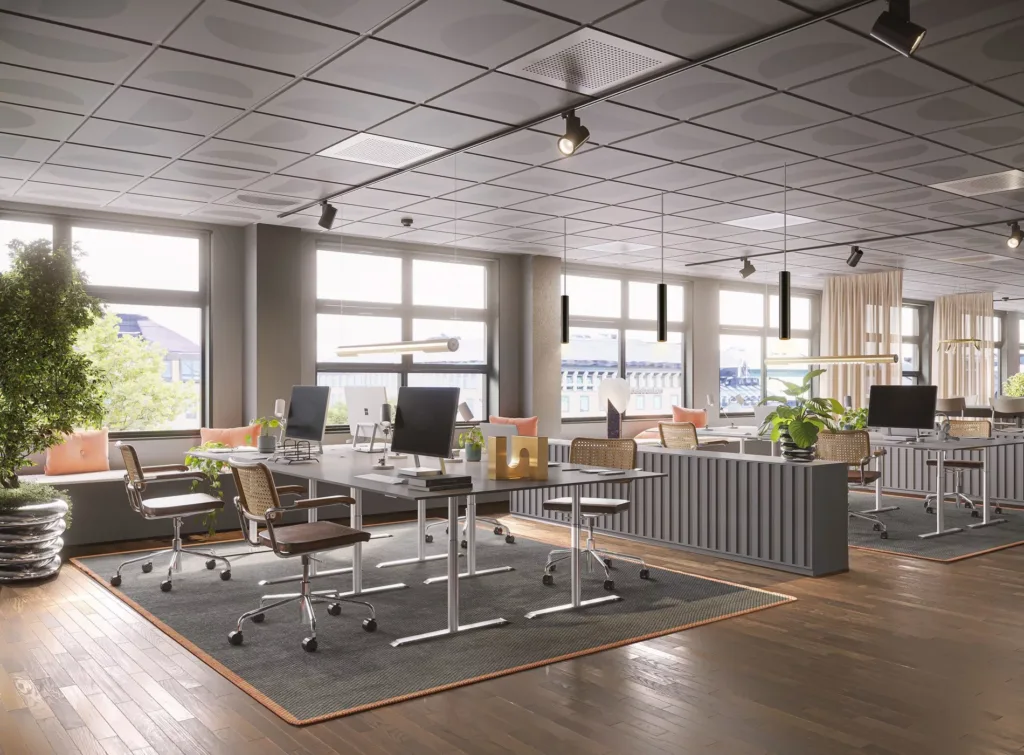 4. Ett kontor med skrivbord, kontorsstolar och stora fönster som släpper in naturligt ljus, samt växter och modern inredning.