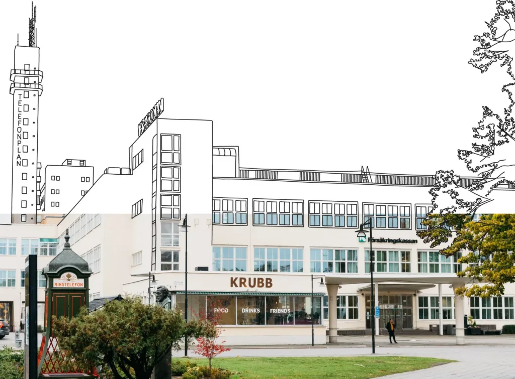En vit byggnad med stora fönster, skylten "KRUBB" synlig på bottenvåningen, och omgivande grönska.