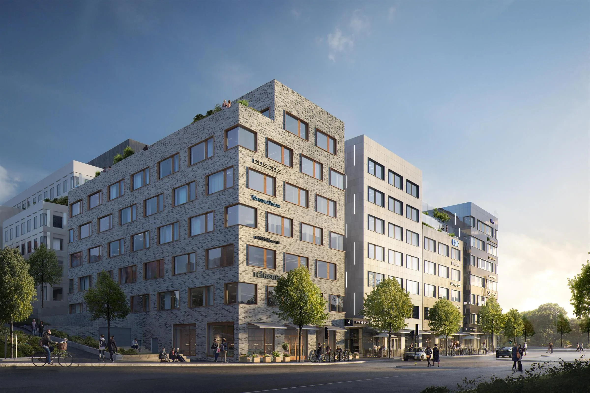 - En modern flerfamiljsfastighet med grå fasad och gröna träd längs trottoaren.