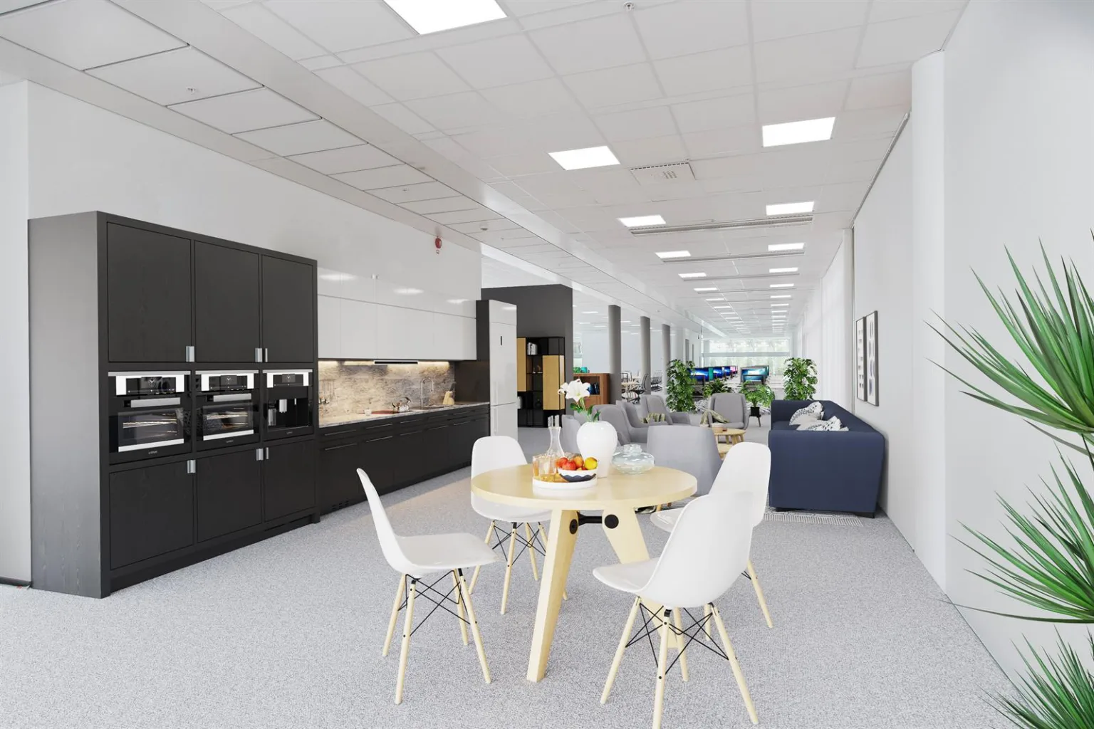 Ett ljust köks- och loungeområde med matbord, stolar och en mörk köksdel.