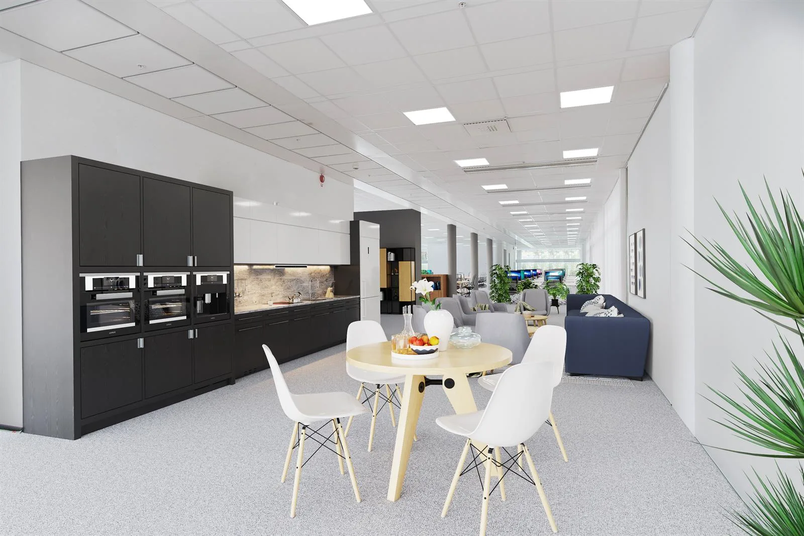 Ett ljust köks- och loungeområde med matbord, stolar och en mörk köksdel.