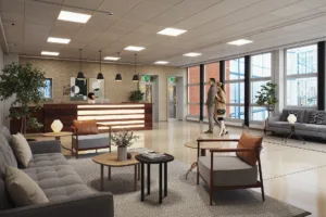 Reception med modern inredning, soffor och fåtöljer, samt människor som står och pratar.